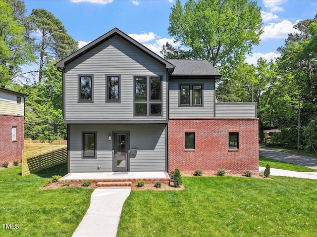 337 Merrywood Dr, Raleigh, NC 27610 - view of front facade with brick siding, a front lawn, covered porch, and fence