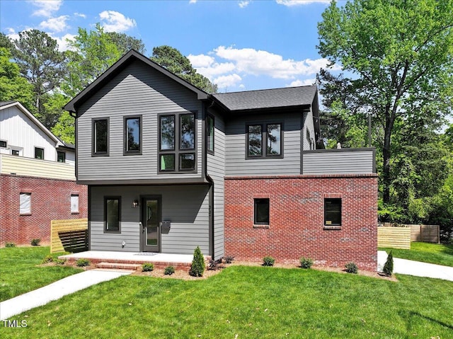337 Merrywood Dr, Raleigh, NC 27610 - view of front facade with brick siding, a front lawn, and covered porch