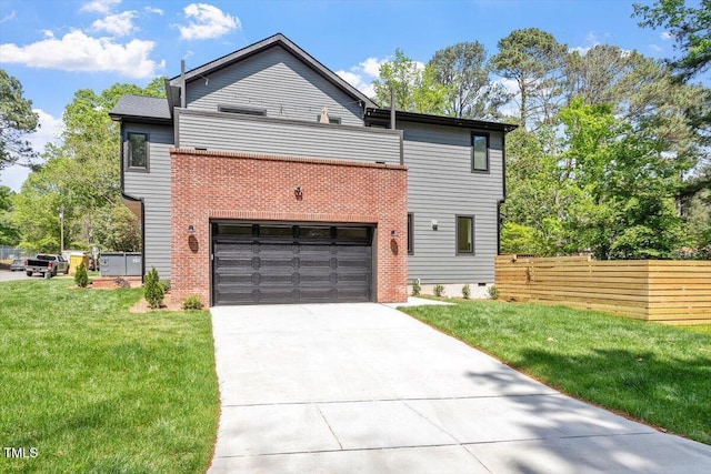 337 Merrywood Dr, Raleigh, NC 27610 - view of side of property featuring an attached garage, a lawn, concrete driveway, and fence