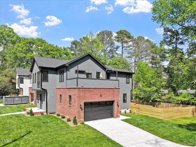 337 Merrywood Dr, Raleigh, NC 27610 - exterior space with concrete driveway, brick siding, a front yard, and a garage