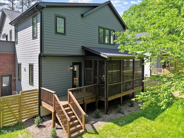 337 Merrywood Dr, Raleigh, NC 27610 - back of property with a sunroom, stairs, and roof with shingles