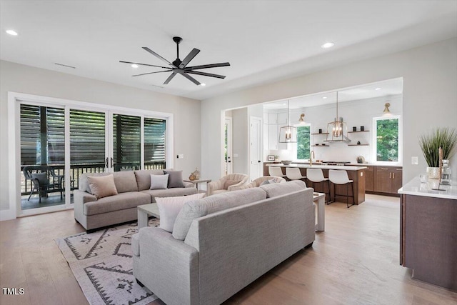 337 Merrywood Dr, Raleigh, NC 27610 - living room with recessed lighting, light wood-type flooring, and a ceiling fan