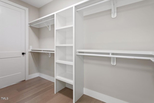 337 Merrywood Dr, Raleigh, NC 27610 - spacious closet featuring wood finished floors