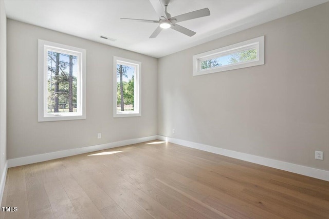 337 Merrywood Dr, Raleigh, NC 27610 - unfurnished room with baseboards, wood finished floors, visible vents, and a wealth of natural light