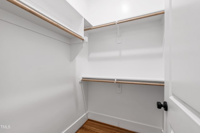 spacious closet with wood finished floors