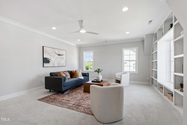 carpeted living area featuring baseboards, visible vents, and a wealth of natural light