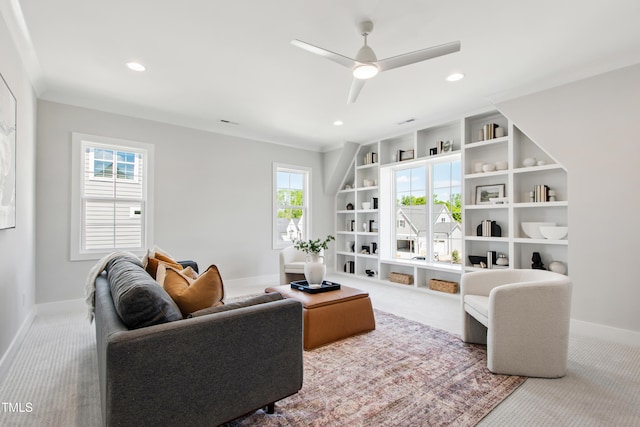 carpeted living room with baseboards, a ceiling fan, built in features, and recessed lighting
