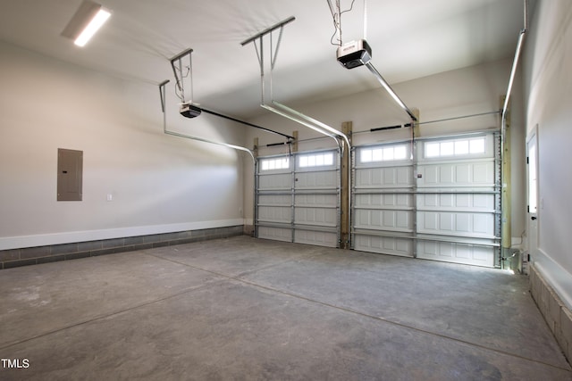 garage with electric panel and a garage door opener