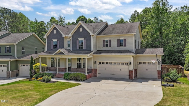 craftsman-style home featuring covered porch, an attached garage, brick siding, and driveway