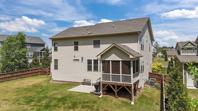 rear view of house with a patio area, a sunroom, and cooling unit
