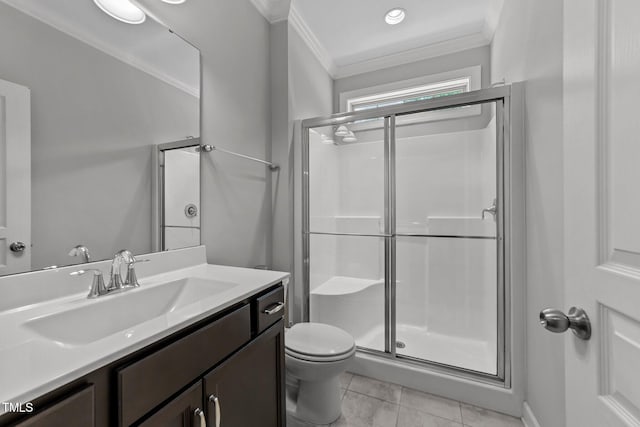 full bathroom with ornamental molding, a stall shower, toilet, vanity, and tile patterned floors