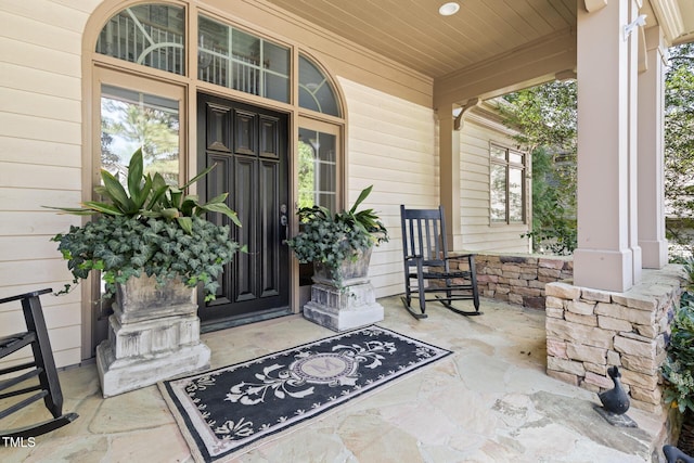 entrance to property featuring covered porch