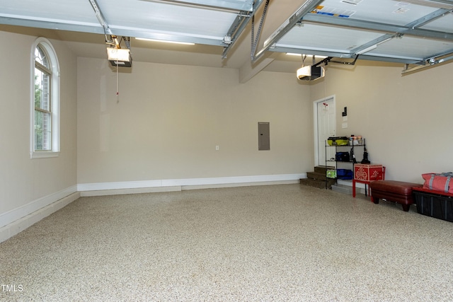 garage with electric panel and a garage door opener