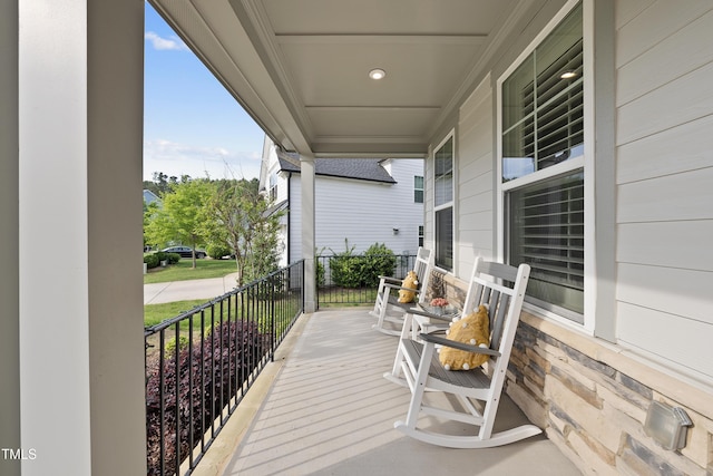 wooden deck featuring covered porch