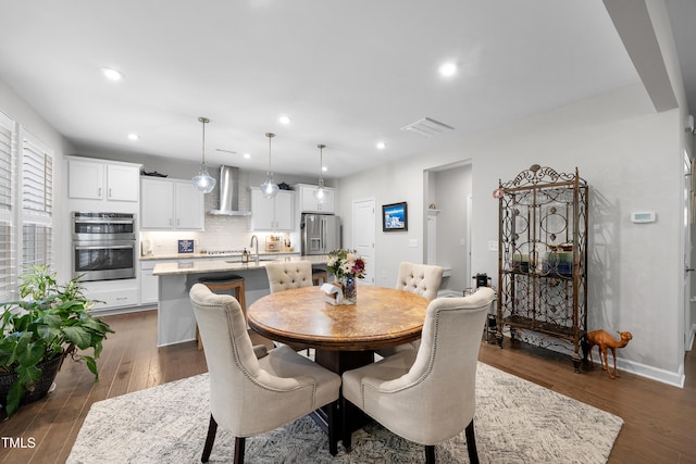 dining space featuring recessed lighting, baseboards, visible vents, and dark wood finished floors