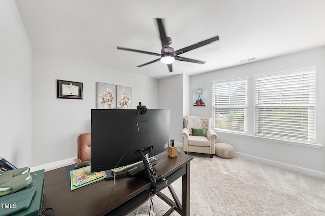 office area featuring ceiling fan, visible vents, baseboards, and carpet