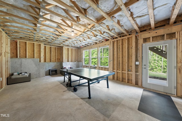 playroom with unfinished concrete floors
