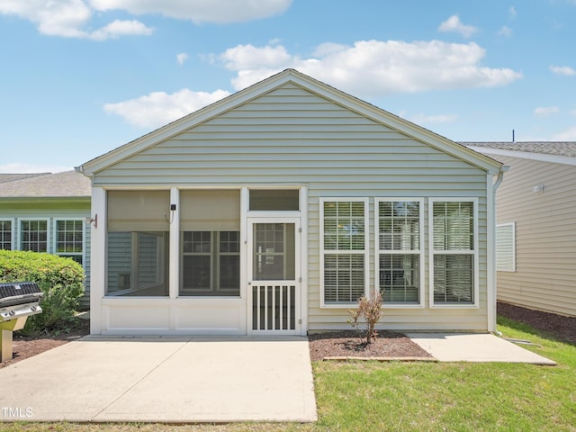 519 Garendon Dr, Cary, NC 27519 - rear view of house with a sunroom and a patio area