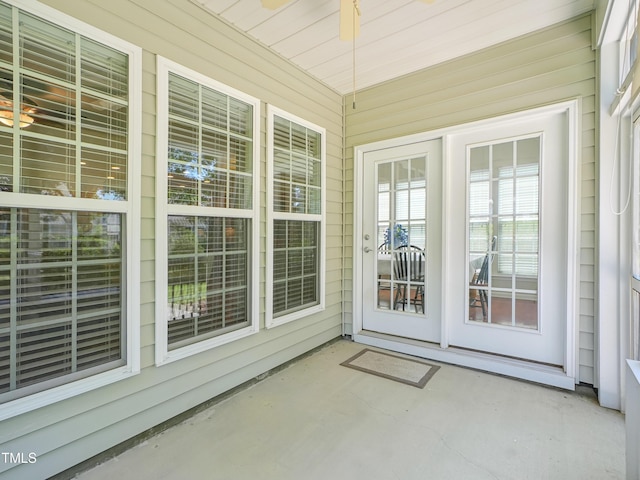 519 Garendon Dr, Cary, NC 27519 - unfurnished sunroom with wood walls and unfinished concrete flooring