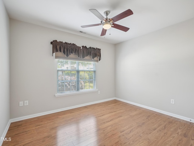 519 Garendon Dr, Cary, NC 27519 - spare room featuring a ceiling fan, baseboards, visible vents, and wood finished floors