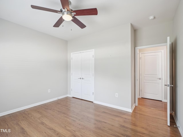 519 Garendon Dr, Cary, NC 27519 - unfurnished bedroom with baseboards, ceiling fan, wood finished floors, and a closet