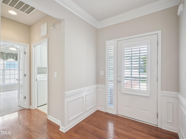 519 Garendon Dr, Cary, NC 27519 - entryway with washer / clothes dryer, plenty of natural light, and wood finished floors