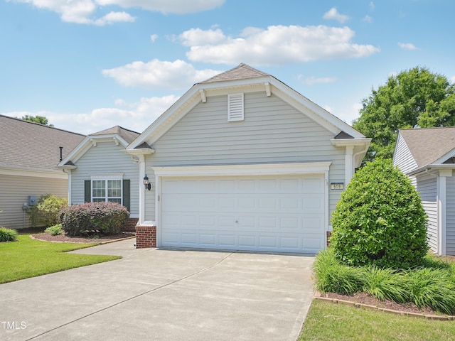 519 Garendon Dr, Cary, NC 27519 - single story home featuring brick siding, an attached garage, and concrete driveway