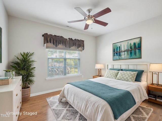 519 Garendon Dr, Cary, NC 27519 - bedroom with visible vents, baseboards, ceiling fan, and light wood-type flooring