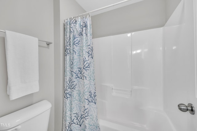 bathroom with toilet and shower / bath combination with curtain