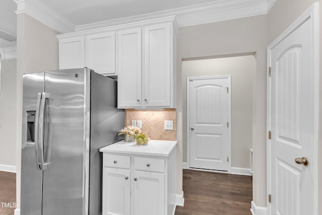 kitchen featuring stainless steel fridge with ice dispenser, crown molding, tasteful backsplash, white cabinets, and light countertops