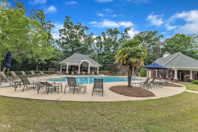 community pool with a gazebo, a yard, and a patio area