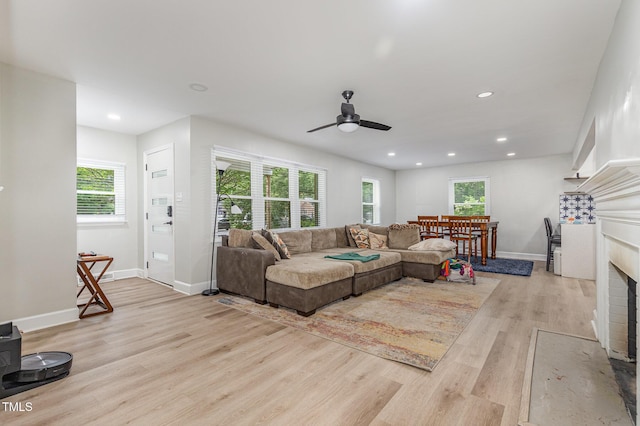 2522 N Roxboro St, Durham, NC 27704 - living area featuring light wood-style floors, healthy amount of natural light, ceiling fan, a fireplace with flush hearth, and recessed lighting