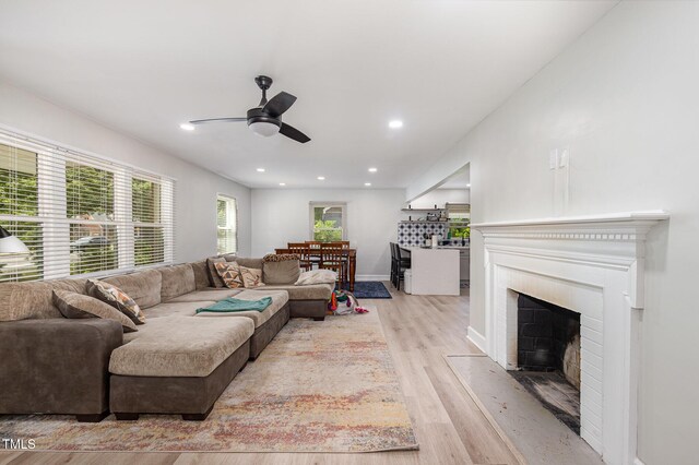 2522 N Roxboro St, Durham, NC 27704 - living room with ceiling fan, light wood-style flooring, recessed lighting, a fireplace, and baseboards