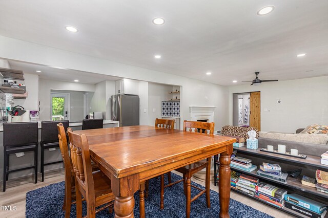 2522 N Roxboro St, Durham, NC 27704 - dining room with ceiling fan, recessed lighting, light wood-style flooring, and a fireplace