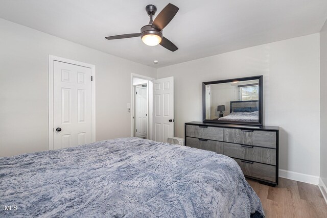 2522 N Roxboro St, Durham, NC 27704 - bedroom featuring light wood-style floors, baseboards, and a ceiling fan