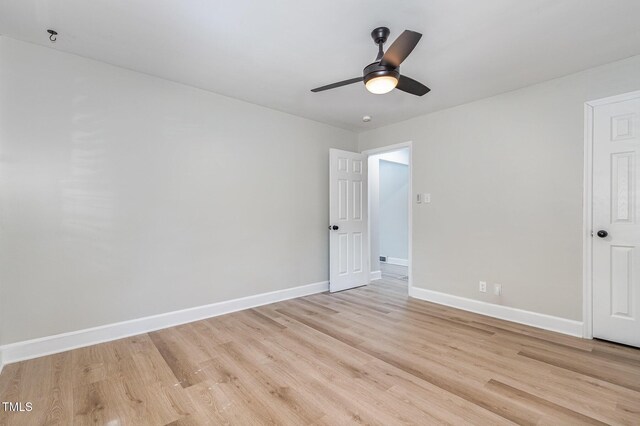 2522 N Roxboro St, Durham, NC 27704 - unfurnished room with light wood-style floors, baseboards, and a ceiling fan