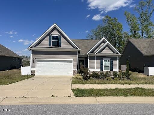 233 Theys Mill Way, Fuquay Varina, NC 27526 - craftsman inspired home with driveway and stone siding