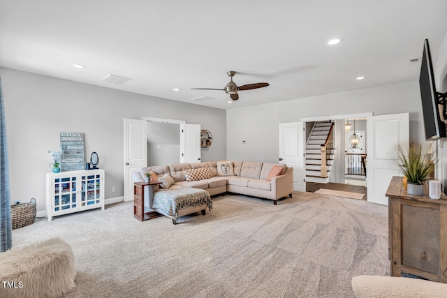 carpeted living room featuring stairs, ceiling fan, recessed lighting, and baseboards