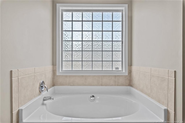 705 Fairfield Cir, Raeford, NC 28376 - bathroom with healthy amount of natural light and a garden tub