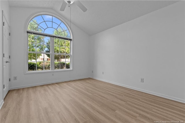 705 Fairfield Cir, Raeford, NC 28376 - unfurnished room featuring vaulted ceiling, a ceiling fan, light wood-type flooring, and baseboards