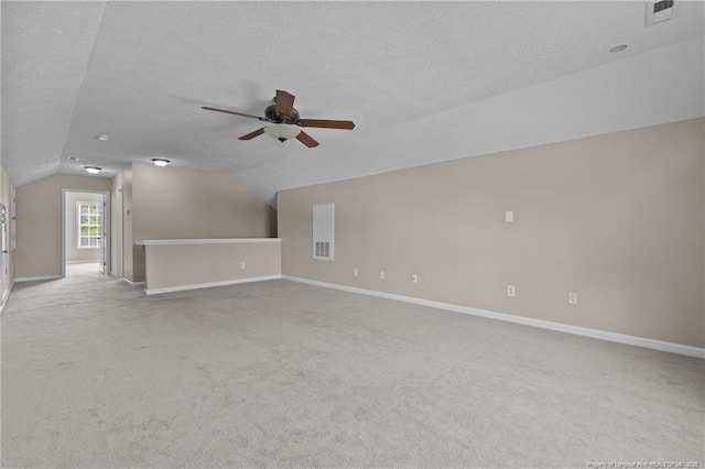 705 Fairfield Cir, Raeford, NC 28376 - additional living space featuring carpet floors, vaulted ceiling, ceiling fan, baseboards, and a textured ceiling