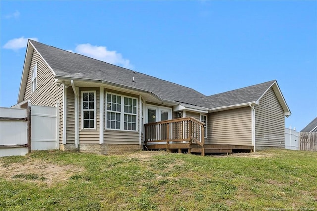 705 Fairfield Cir, Raeford, NC 28376 - back of property featuring a wooden deck and roof with shingles