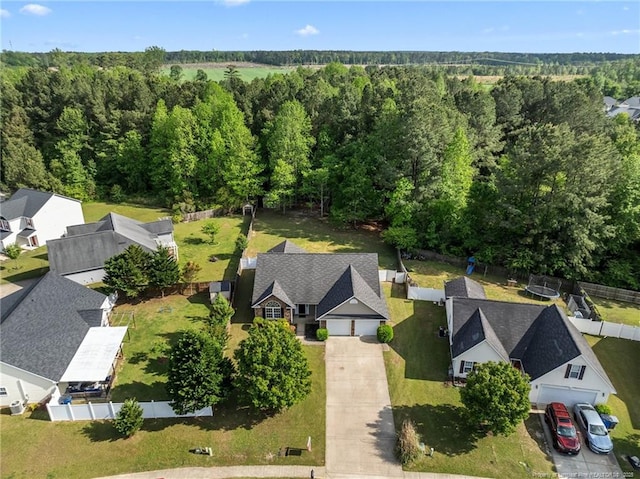 705 Fairfield Cir, Raeford, NC 28376 - aerial perspective of suburban area with a heavily wooded area