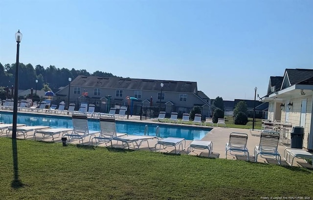 705 Fairfield Cir, Raeford, NC 28376 - community pool with a patio and a residential view