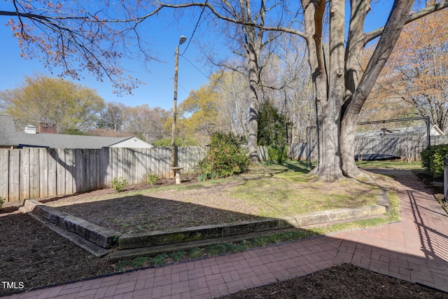 view of yard with a fenced backyard