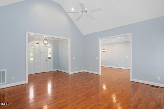 2420 Mollynick Ln, Wake Forest, NC 27587 - unfurnished living room with high vaulted ceiling, ceiling fan, wood-type flooring, and baseboards