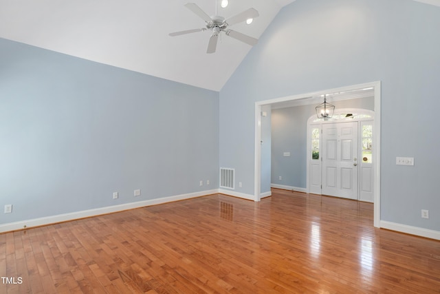 2420 Mollynick Ln, Wake Forest, NC 27587 - unfurnished room with high vaulted ceiling, ceiling fan, wood finished floors, baseboards, and a chandelier