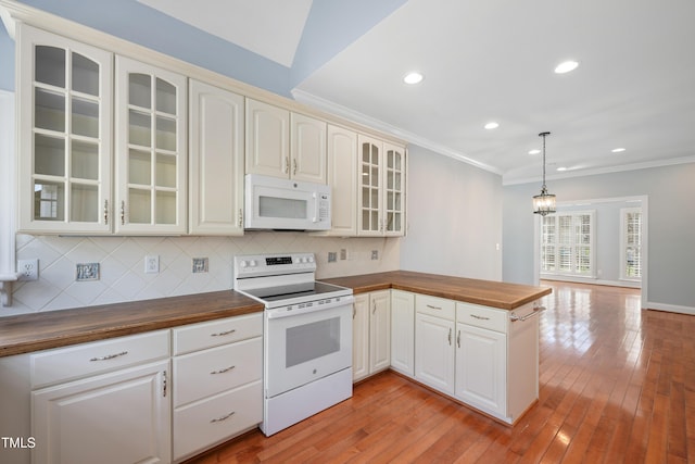 2420 Mollynick Ln, Wake Forest, NC 27587 - kitchen with white appliances, butcher block counters, a peninsula, backsplash, and ornamental molding