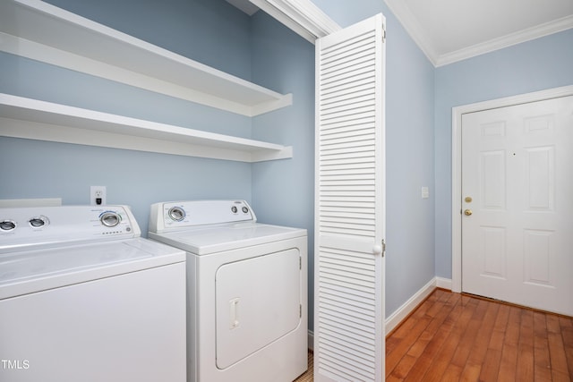 2420 Mollynick Ln, Wake Forest, NC 27587 - laundry room featuring ornamental molding, washing machine and clothes dryer, light wood-type flooring, and baseboards