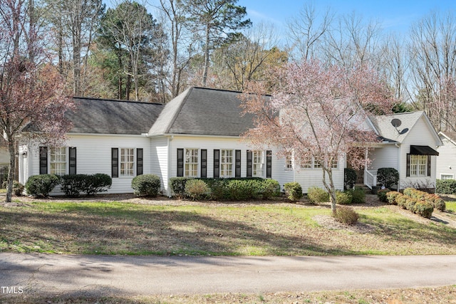 2420 Mollynick Ln, Wake Forest, NC 27587 - view of front of house with a front yard and roof with shingles